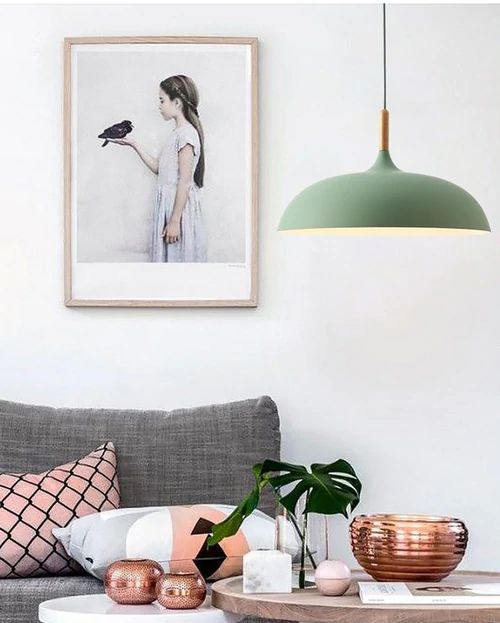 Metal and wood pendant lights in delicate pastel tones