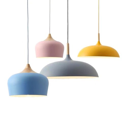 Metal and wood pendant lights in delicate pastel tones