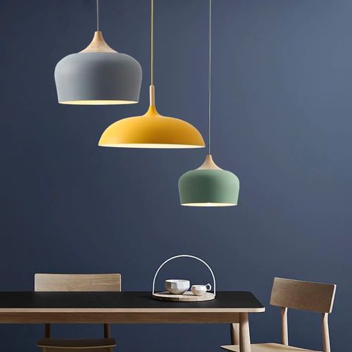 Metal and wood pendant lights in delicate pastel tones